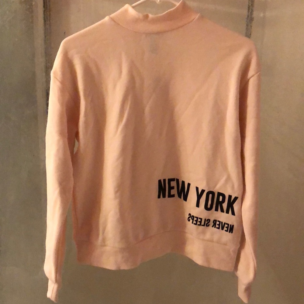 “New York Never Sleeps” sweatshirt by Forever 21